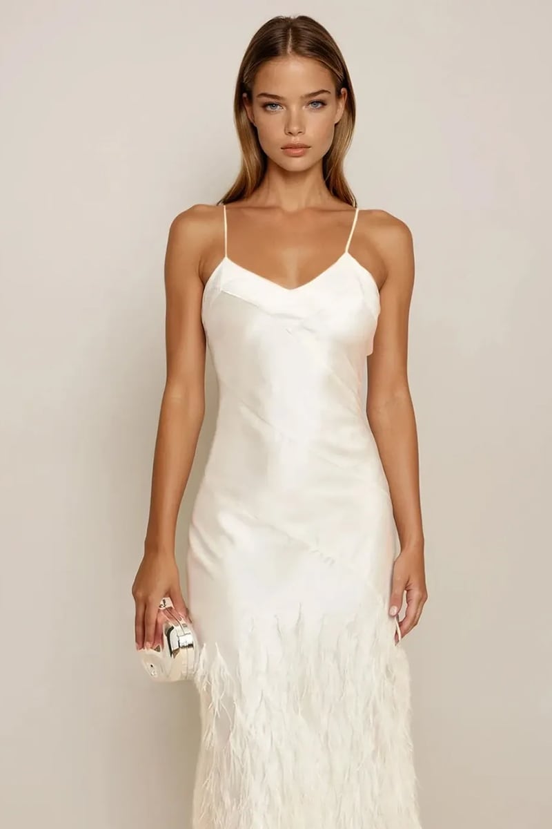 Bridal or evening look featuring feathered satin gown
